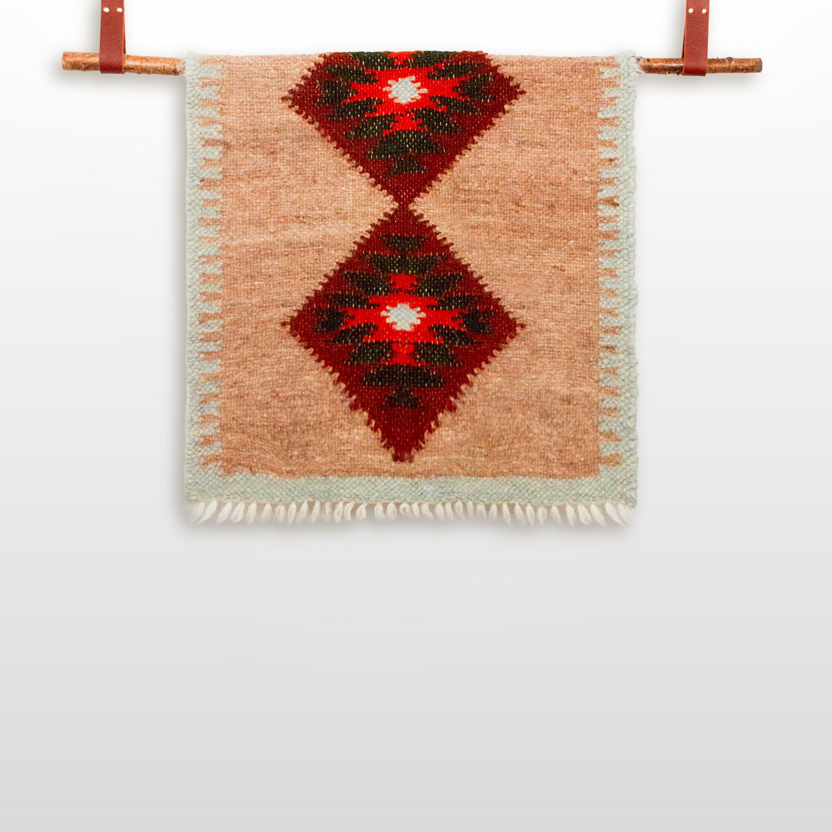 (Make bed runner in first listing photo the same size/dimension as version A - delete this when complete)
Handmade in Ukraine from organic 100% sheep wool, this woven bed or couch runner features two red diamond patterns and hangs elegantly on a wooden rod with leather straps.