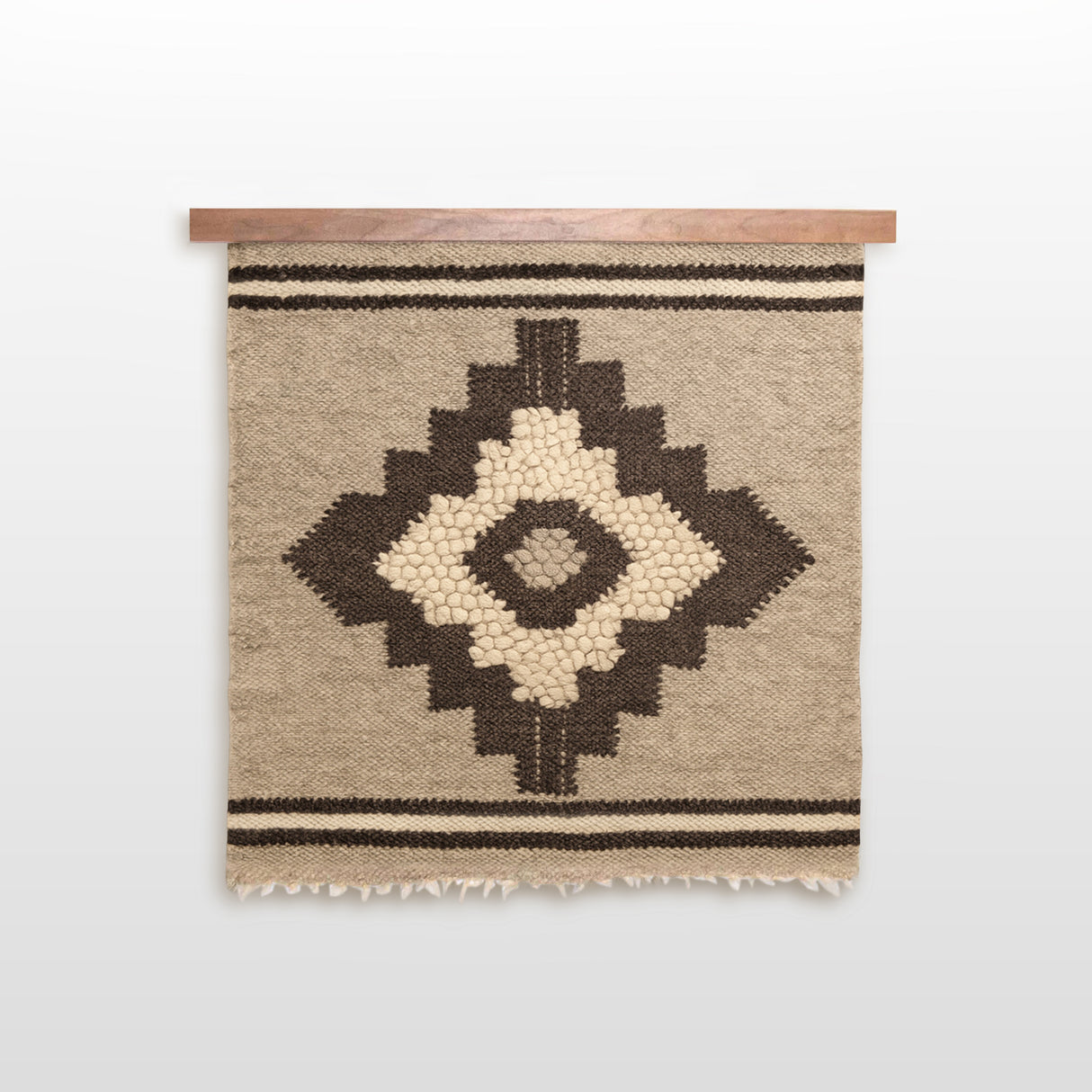 The Karaliene (Queen) Wool Wall Hanging features handcrafted beige wool with a central black rhombus-dot motif and two bold horizontal black stripes.