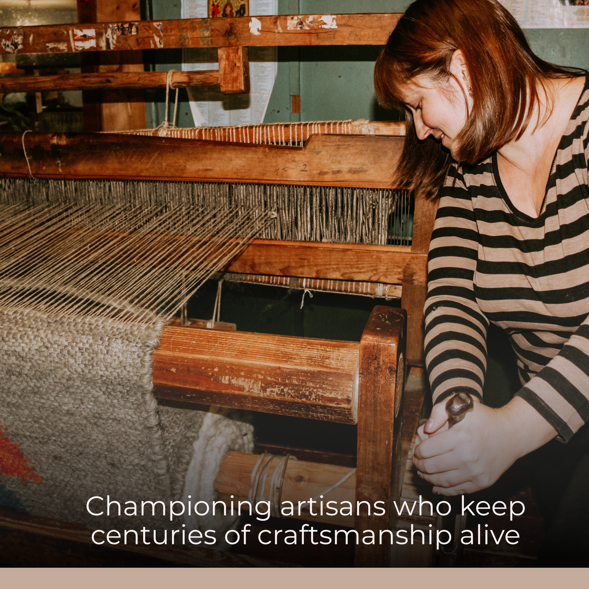 A woman weaves a Sosna (Pine) Wool Statement Bed Blanket on a wooden loom in a traditional workshop.