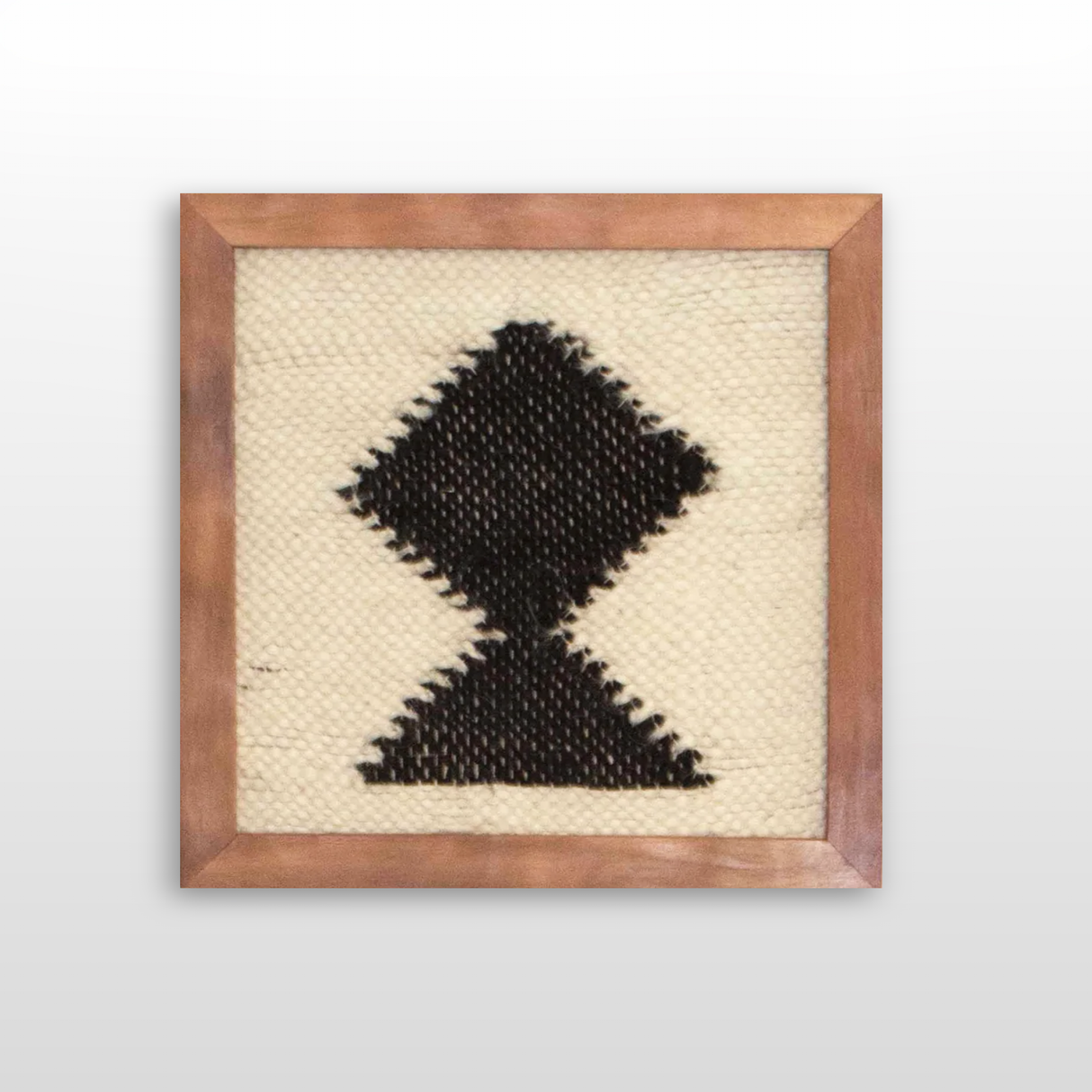 The Blysk (Shine) Wool Framed Wall Art features a handcrafted black geometric diamond and triangle design on cream, made with premium Carpathian wool for a striking and timeless tapestry wall hanging.