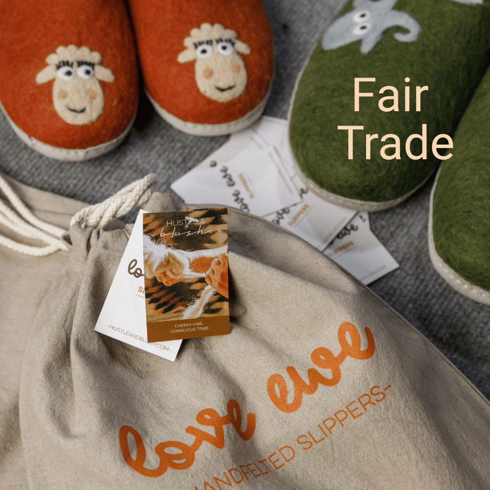 Pair of whimsical wool slippers and a linen bag labeled