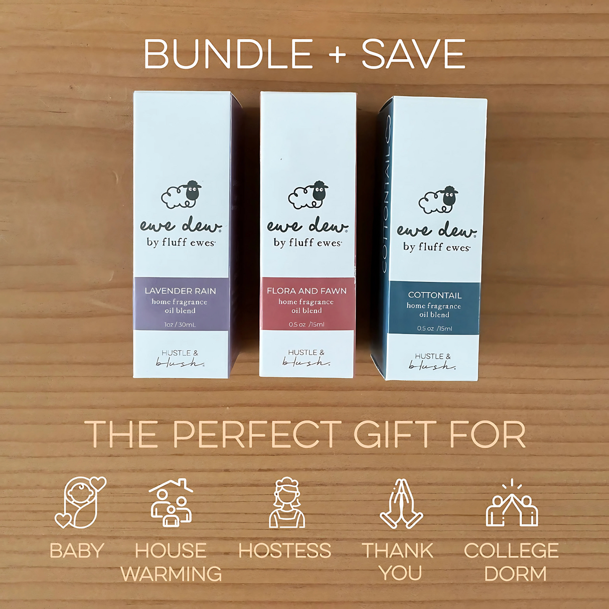Three Ewe Dew by Fluff Ewes Flora & Fawn boxes sit on a wooden table, bundled as a gift set for any occasion. Each features a light, fresh floral essential oil blend for wool dryer balls, fabric freshening, or use in an oil diffuser.