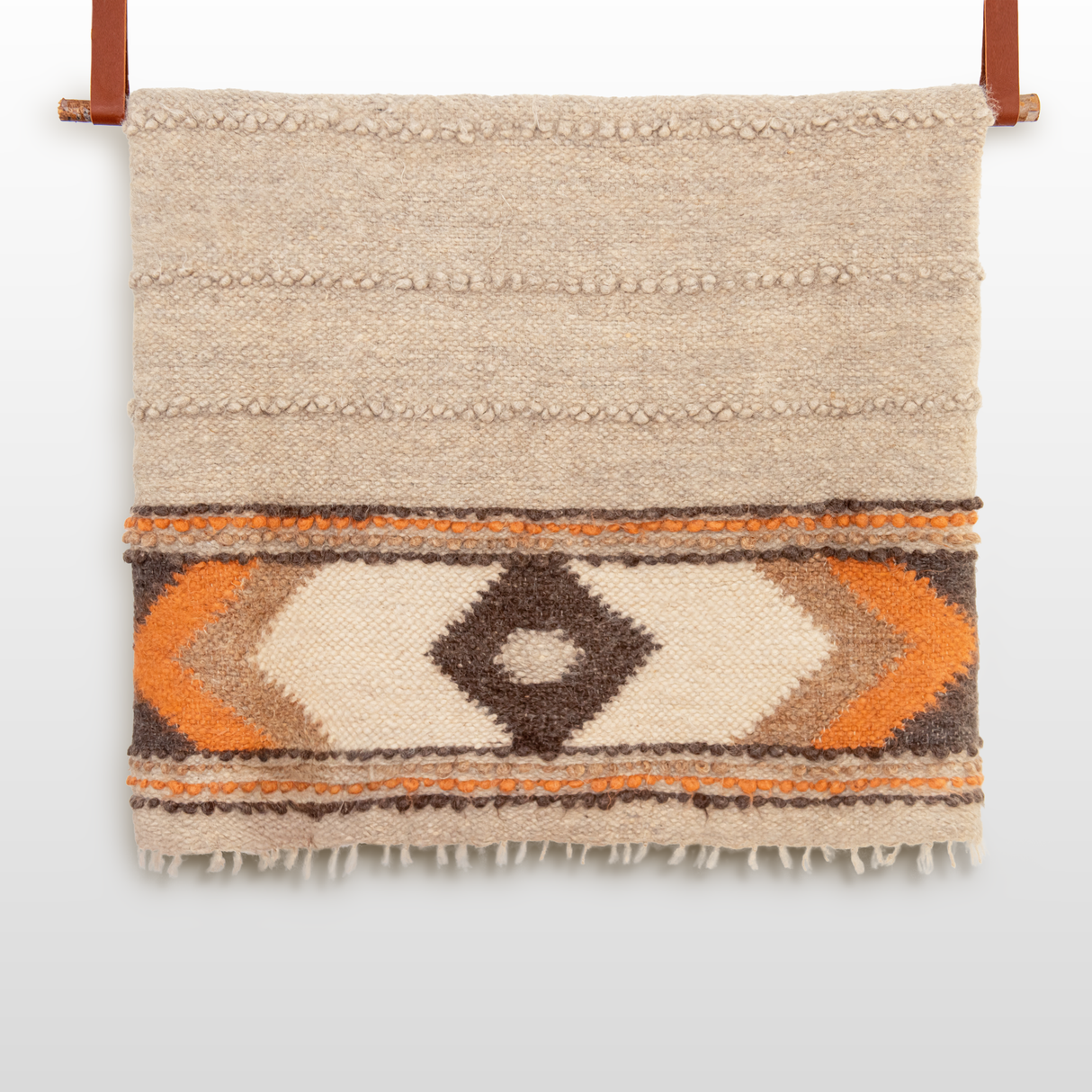 A close-up of the Tkach (Weaver) Wool Statement Bed Blanket, woven with intricate detail reminiscent of handcrafted design.