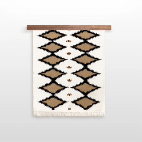 The Handmade in Ukraine Organic Natural 100% Sheep Wool Woven Rug Wall Hanging Decor features a black and brown geometric diamond pattern on white, hanging from a wooden rod for an eco-friendly, neutral accent.