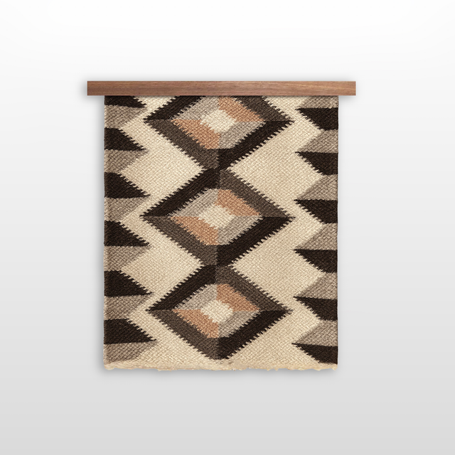 The Svitlo (Bright) Wool Wall Hanging features geometric patterns in earth tones, crafted from organic Carpathian wool, and is displayed hanging on a wooden rod against a white background.