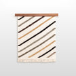 The Handmade in Ukraine Organic Natural 100% Sheep Wool Woven Rug Wall Hanging Decor features diagonal tan, black, and gray stripes with fringe, making it a stylish and eco-friendly accent for your space.