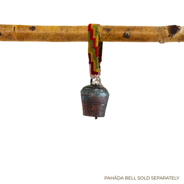 Ornament Straps for Hanging Vintage Bells: Colorful hand-woven strap holds a small vintage metal bell, displayed on a wooden branch against a white background.