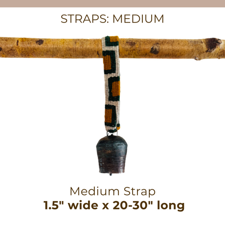 A Medium Straps for Hanging Vintage Bells, artisan-made and sized 1.5" wide by 20-30" long with a metal bell, hangs from a branch.