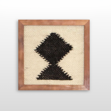 The Blysk (Shine) Wool Framed Wall Art features a handcrafted black geometric diamond and triangle design on cream, made with premium Carpathian wool for a striking and timeless tapestry wall hanging.