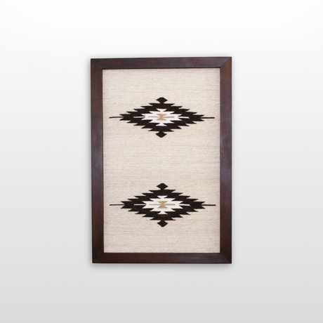 Wool Rug Framed Wall Art, handwoven from Carpathian wool, showcases two black and white geometric diamond patterns on a cream background—an elegant and sustainable home decor accent.