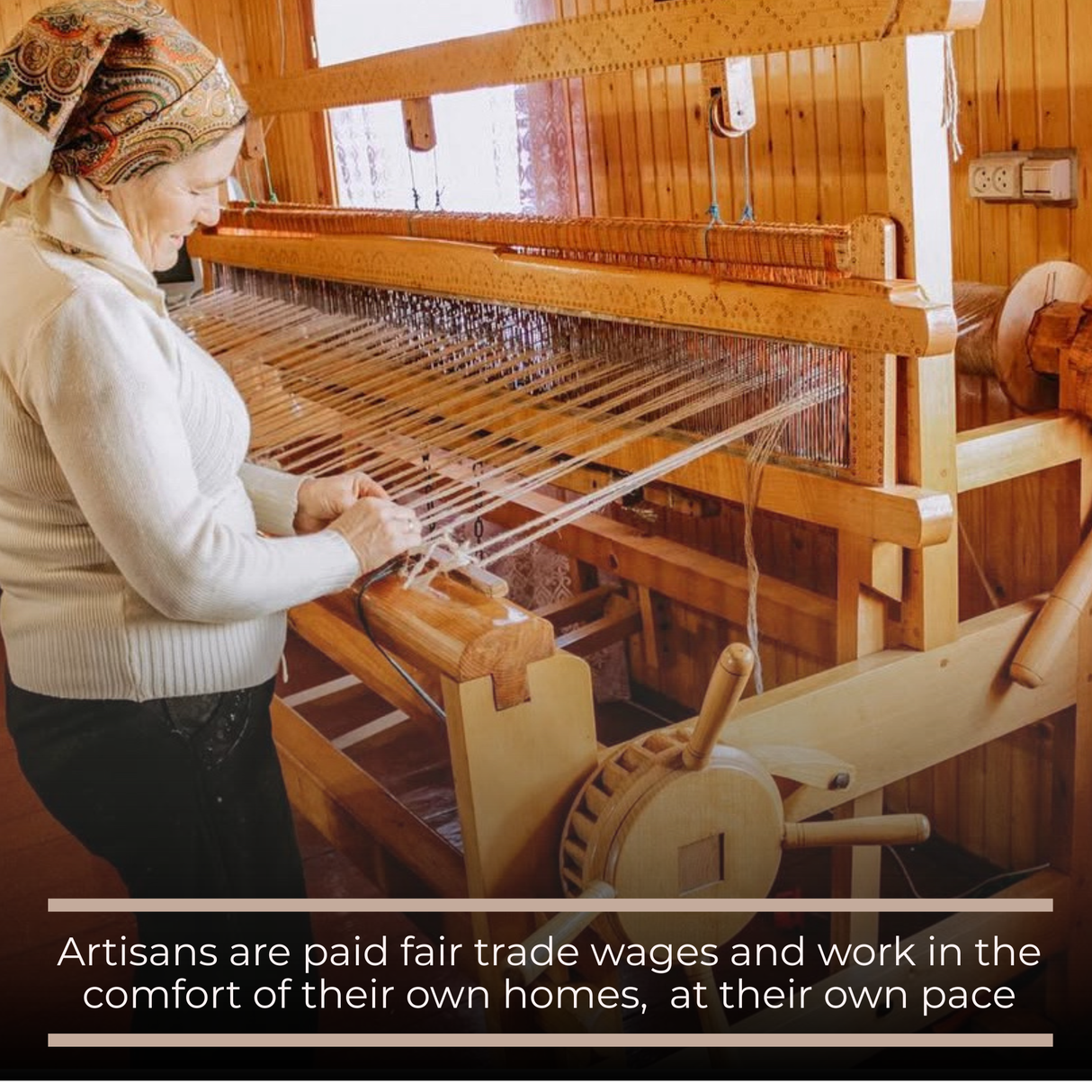 A woman handweaves the Myr (Peace) Wool Bed / Couch Runner on a wooden loom in a sunlit room, crafting this beautiful, artisanal piece.