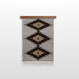 The Handmade in Ukraine Organic Natural 100% Sheep Wool Woven Rug Wall Hanging Decor features geometric diamond patterns in brown, beige, and blue on gray, evoking the classic style of Ukrainian artisan craftsmanship.