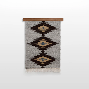 The Handmade in Ukraine Organic Natural 100% Sheep Wool Woven Rug Wall Hanging Decor features geometric diamond patterns in brown, beige, and blue on gray, evoking the classic style of Ukrainian artisan craftsmanship.