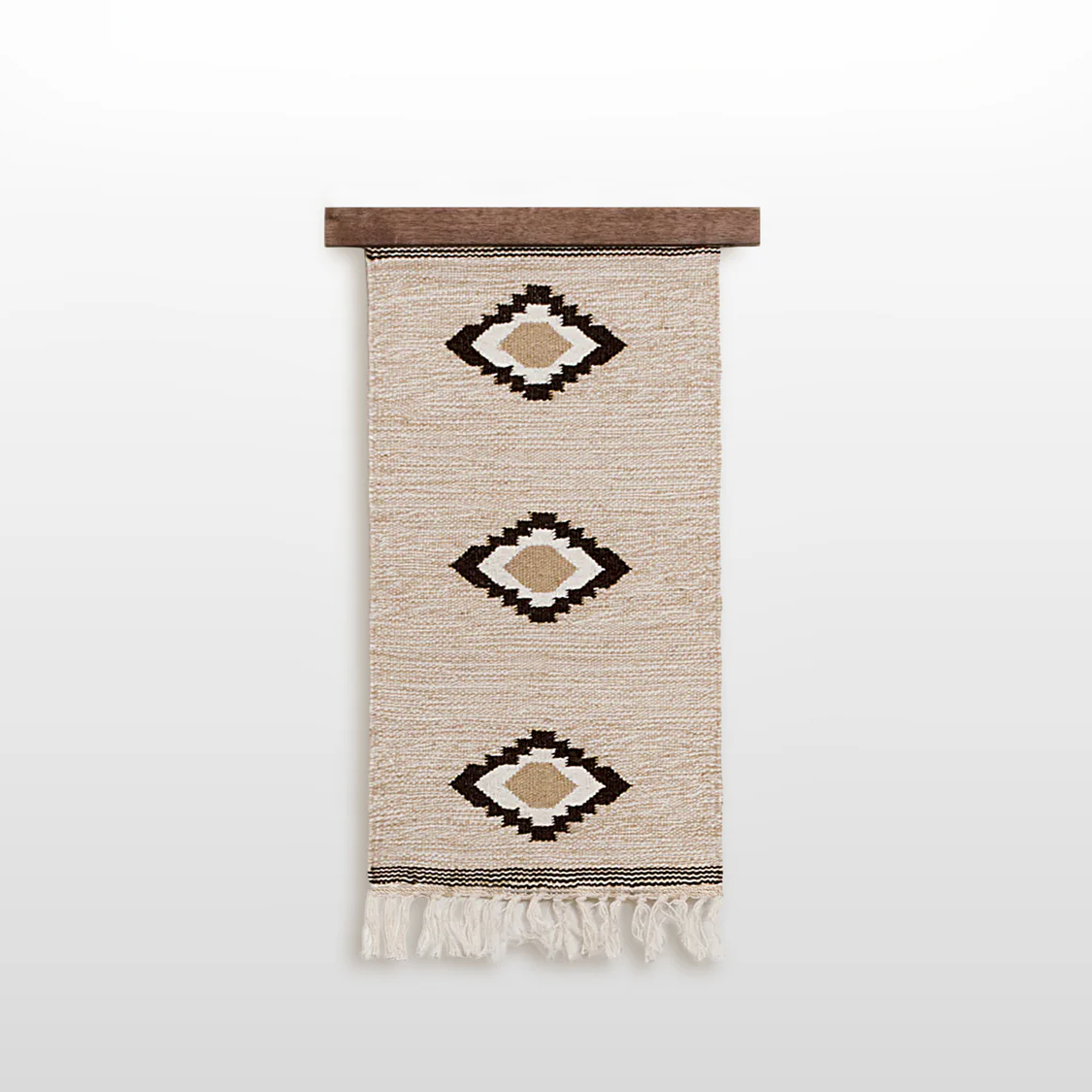 Handmade in Ukraine, this organic 100% sheep wool woven wall hanging decor features three geometric diamond patterns and fringe, crafted by artisans and displayed on a wooden rod.