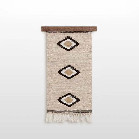 Handmade in Ukraine, this organic 100% sheep wool woven wall hanging decor features three geometric diamond patterns and fringe, crafted by artisans and displayed on a wooden rod.
