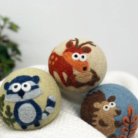 The Fluff Ewes "Hedgehog & Homies" Woodland Themed 100% Premium Wool Dryer Balls 3-pack features eco-friendly, cute deer, raccoon, and hedgehog designs for a natural, sustainable laundry solution.