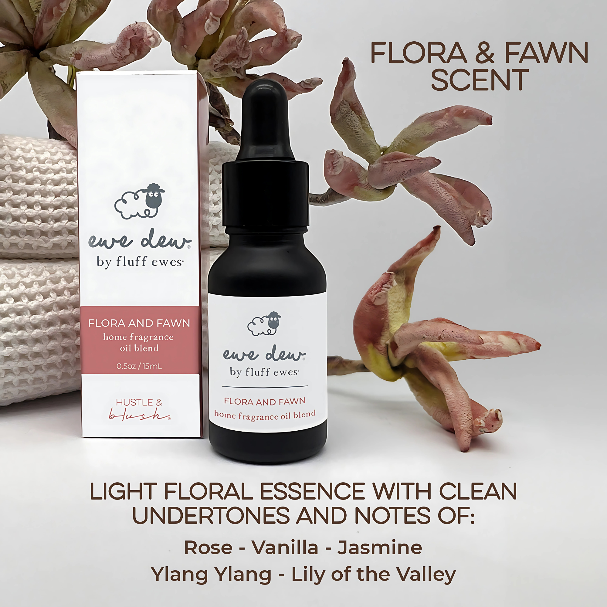 A 0.5 fl oz Ewe Dew by Fluff Ewes Flora & Fawn bottle and box with a light, fresh floral fragrance—ideal as a wool dryer ball or diffuser oil—featured with delicate flowers, promoting a gentle scent for laundry and home.