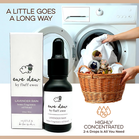 Ewe Dew by Fluff Ewes Lavender Rain Laundry & Home Fragrance Oil (0.5 fl oz) shown with dryer balls beside a laundry basket; "A little goes a long way" highlights this lavender citrus essential oil for fabric and dryer ball refreshment.