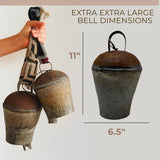Hand holding two large Vintage Handmade Pahāḍa Yak, Goat & Sheep's Bells from the Himalayas; separate image shows an 11" tall by 6.5" wide fair trade bell, handcrafted in Nepal—ideal for ornaments, wreath decor, or sound baths.