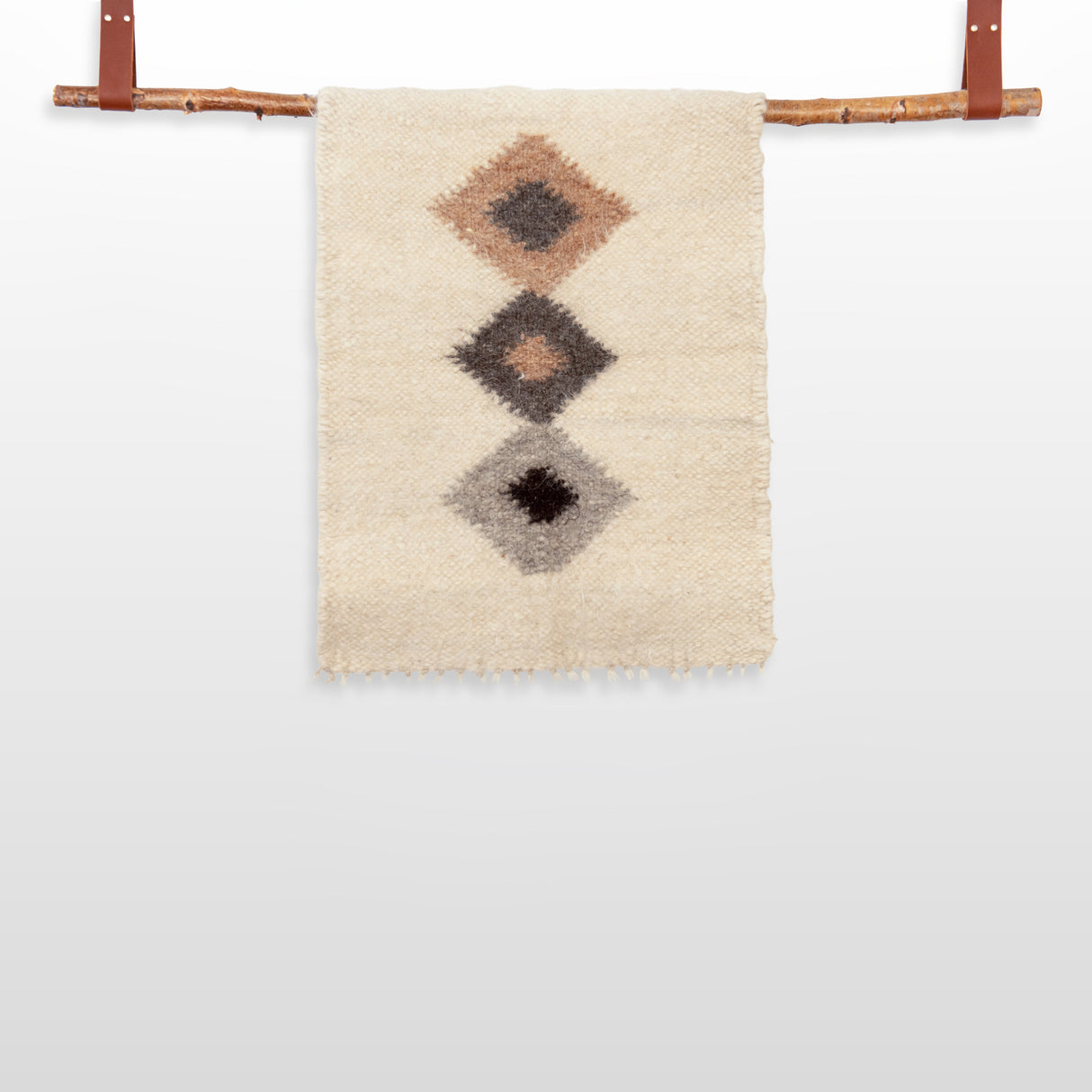 The Harny (Beautiful) Wool Framed Wall Art features three diamond designs on woven fabric, displayed on a handcrafted cedar frame with leather straps—ideal as nursery décor or stylish wall art.