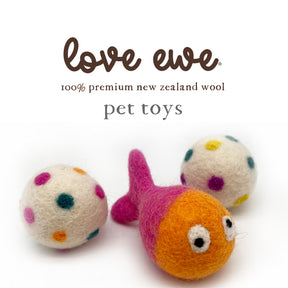 Two polka-dot wool balls and an orange and pink fish-shaped toy from Love Ewe Handmade Felt Pet Toys for Cats, Kittens, Dogs, Small Pets: Hook, Line & Jingle, displayed on a white background with "love ewe" branding above.