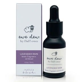 A 0.5 fl oz/15mL bottle of Ewe Dew by Fluff Ewes Lavender Rain Laundry, Home Fragrance + Aromatherapy Essential Oil Blend—use with wool dryer balls or an oil diffuser for a fresh lavender citrus scent.