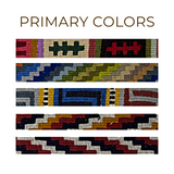 Four colorful woven bands with geometric patterns, designed as Large Straps for Hanging Vintage Bells, are displayed under the text "Primary Colors" on a white background.