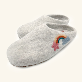 Love Ewe Hand-Felted Organic Wool Slippers for Women (Rainbow-Light) have hand-sewn soles and feature a rainbow, blue cloud, and pink star embroidered on the gray felt top.