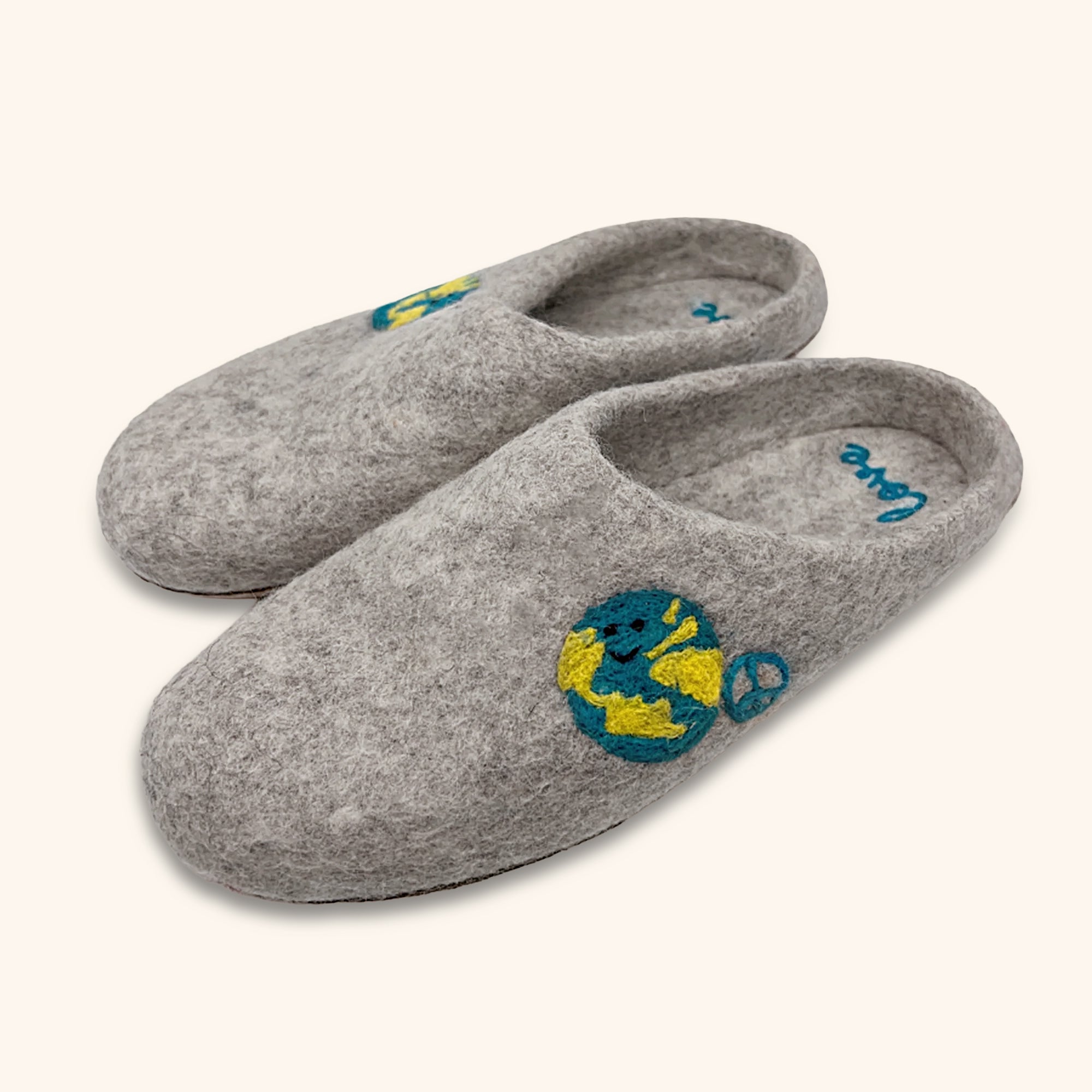 Love Ewe Hand-Felted Organic Wool Slippers for Women (Peace-DG) feature hand-sewn suede soles and an embroidered Earth and peace sign—offering a cozy, sustainable slipper option.