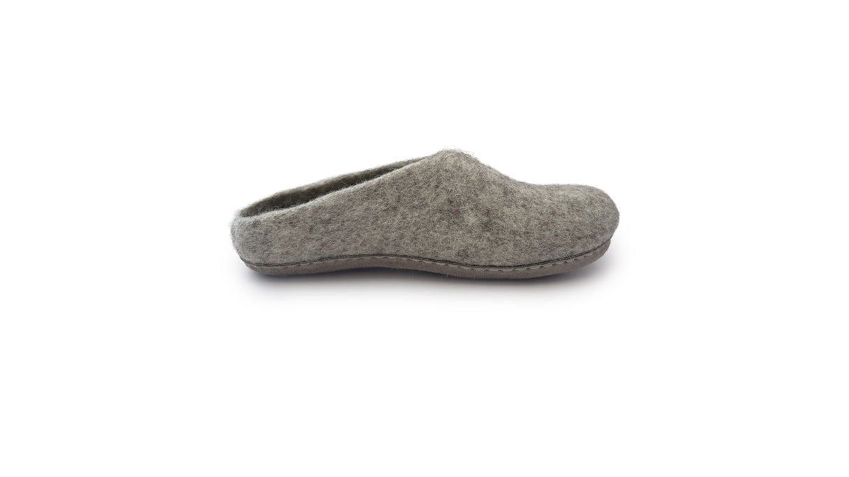 A side view of a single Love Ewe Hand-Felted Organic Wool Slipper for Women (Rainbow-Bright) with a closed toe and open heel, handmade from organic wool, shown on a white background.