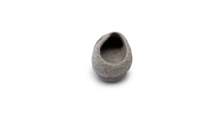 A single Love Ewe Hand-Felted Organic Wool Slipper for Women (Rainbow-Light), handmade in Nepal and shown from the heel, is displayed on a white background.