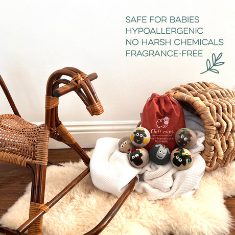 Fluff Ewes Premium XL Dryer Balls "Sheep in Heavenly Peace" 6 Pack—Holiday Limited Edition—featured for safe, hypoallergenic, natural fabric softening alongside a wicker rocking horse and a red bag on a blanket.