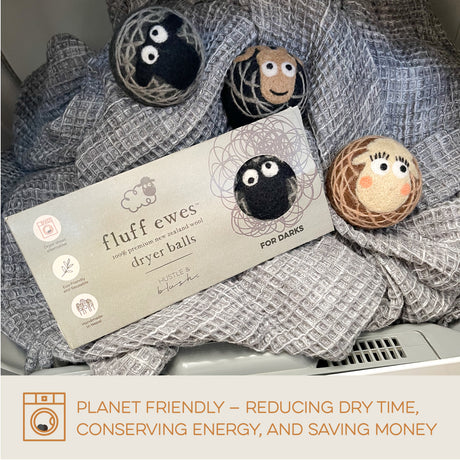 Eight packs of Fluff Ewes Dryer Balls—get 2 free in this Multi-pack Gift Bundle for the price of 6, saving $68. The eco-friendly packaging sits on a textured gray towel inside a dryer. Your friends will love ewe!.